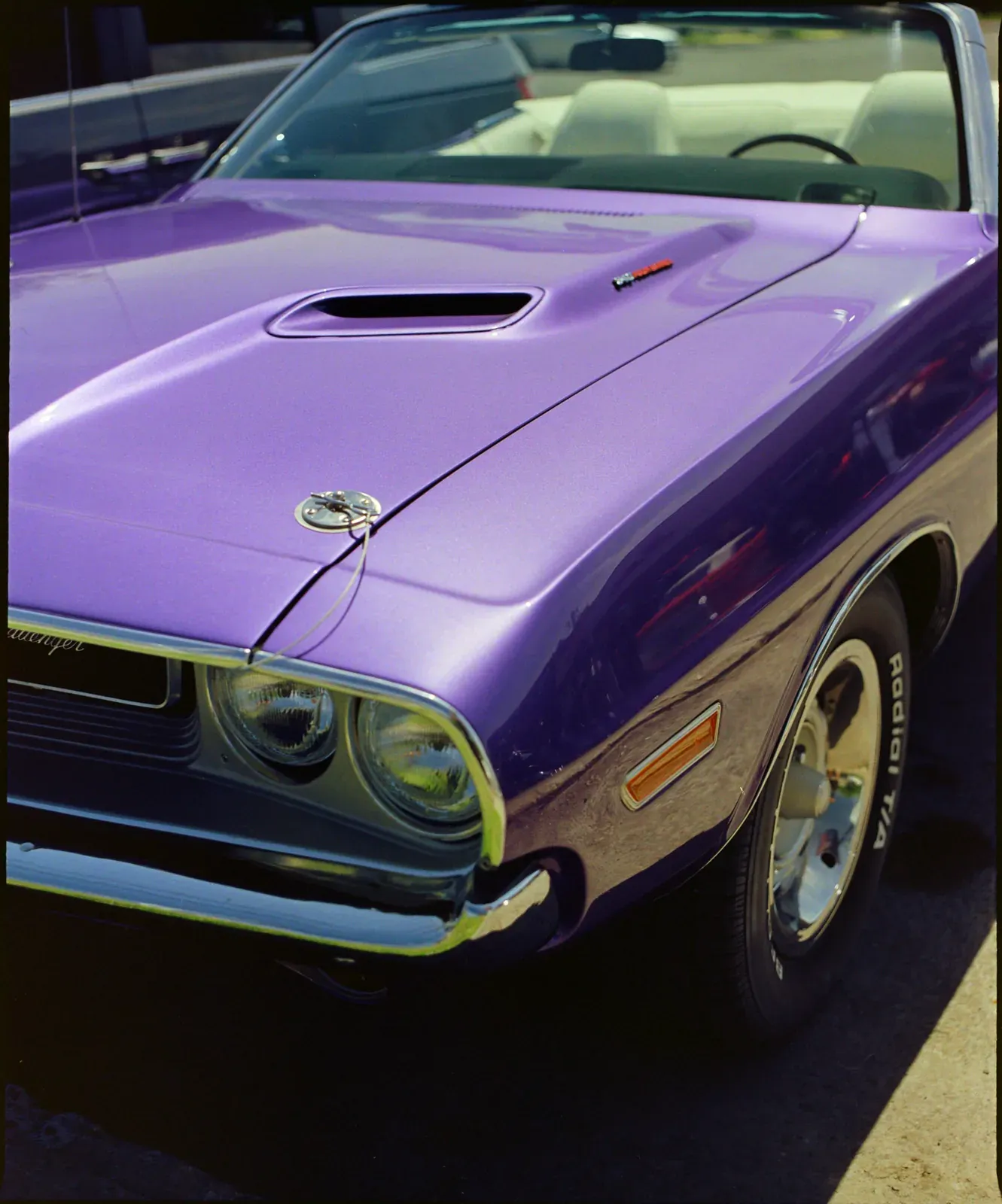 The hood of a purple convertible, converted from a colour negative