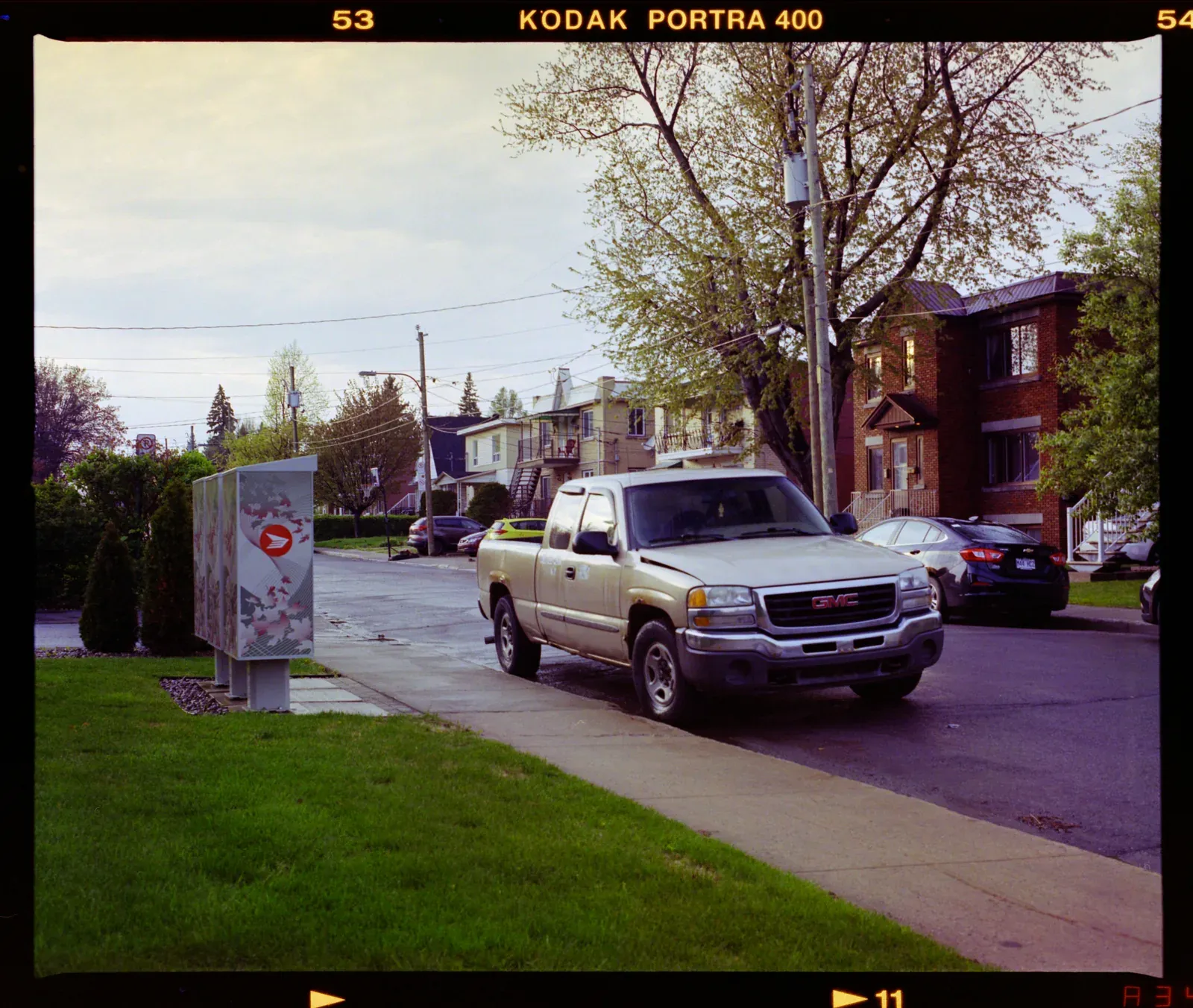 A pickup truck on a suburban street, converted with Pearl 160, in the Monobath editor